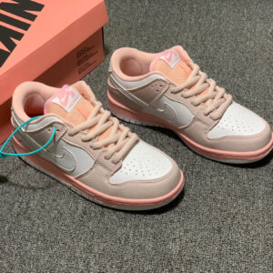 Side view of Nike Pink/White Pigeon SB Dunk Low featuring pink leather and embroidered pigeon detail.