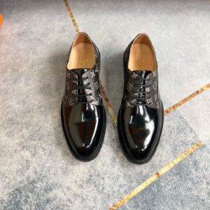 Pair of Ribbed Patent Black Derby Shoes in glossy black with vertical ribbed side texture