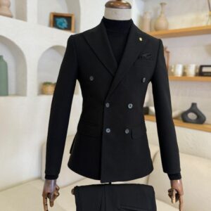 Front view of a Sartorial Black Double-Breasted Suit on a mannequin, styled with a black turtleneck for a formal winter wedding look.