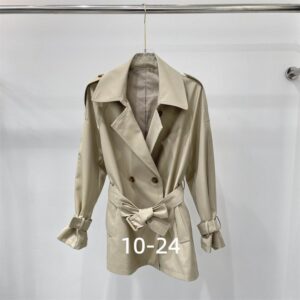 Short double-breasted women's trench coat in Light Beige/Cream with a large, oversized collar and belted waist.