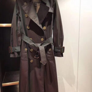 Long double-breasted unisex trench coat in Iridescent Plum/Mahogany with belted waist and check lining. Westminster-style design