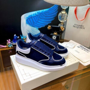 Alexander McQueen Blue White Oversized Sneakers in navy blue suede with a thick white platform sole.
