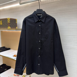 Front view of the Acne Studios Black Oversized Shirt hanging in a luxury retail setting.