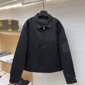 Front view of the Chrome Hearts Black Workwear Harrington Jacket featuring leather cross patches and a silver dagger zipper.