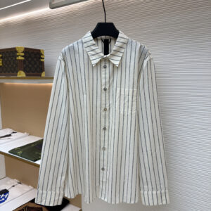 Front view of a Chrome Hearts Cream Vertical Stripe Shirt featuring black patterned stripes and signature metal buttons on a hanger.