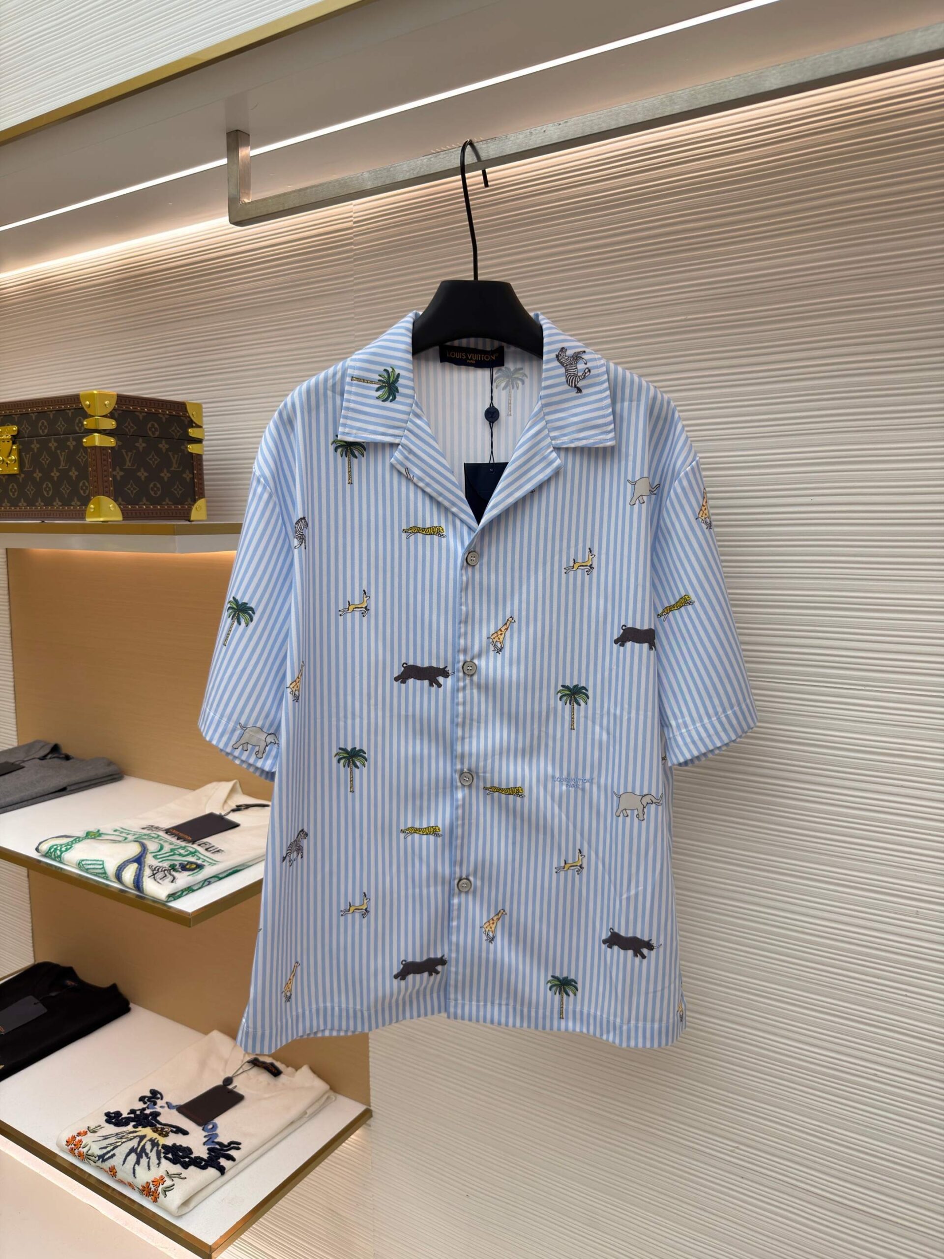 Louis Vuitton Blue Striped Shirt with light blue stripes, safari embroidery, short sleeves, and camp collar