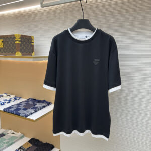 A high-quality Prada Black Layered T-Shirt in black featuring integrated white trim layers and a tonal logo on the chest.
