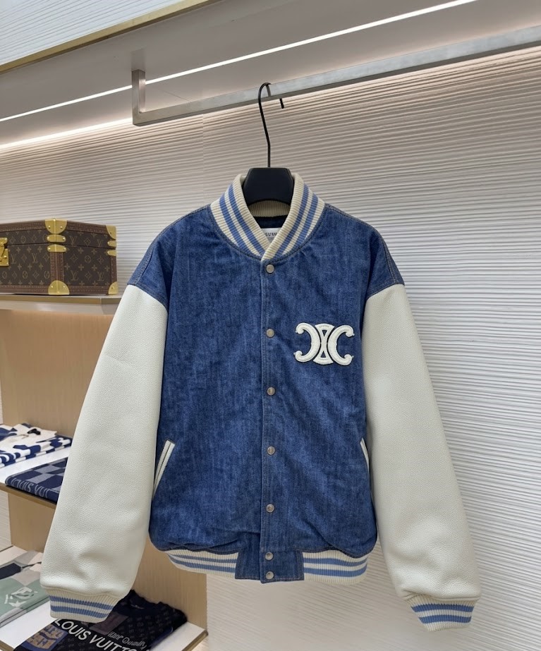Blue and white Celine Paris Denim Varsity Jacket featuring a Triomphe logo patch and classic striped ribbed trim. Back view of the Celine Paris Denim Varsity Jacket showcasing the bold "CELINE PARIS" white embroidery.