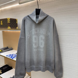 Front view of the Acne Studios Grey Melange Hoodie featuring the Stockholm 96 graphic and a funnel-neck hood on a display hanger.