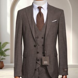 A man’s textured brown three-piece slim-fit suit featuring a double-breasted waistcoat and white dress shirt on a mannequin.