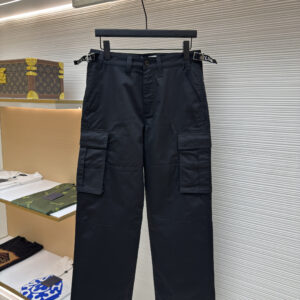 Front view of Celine black cargo trousers featuring adjustable logo-print waist buckles and large utility side pockets.