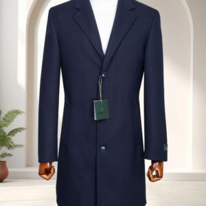 A premium classic navy single-breasted overcoat with notch lapels and a white turtleneck sweater displayed on a mannequin.