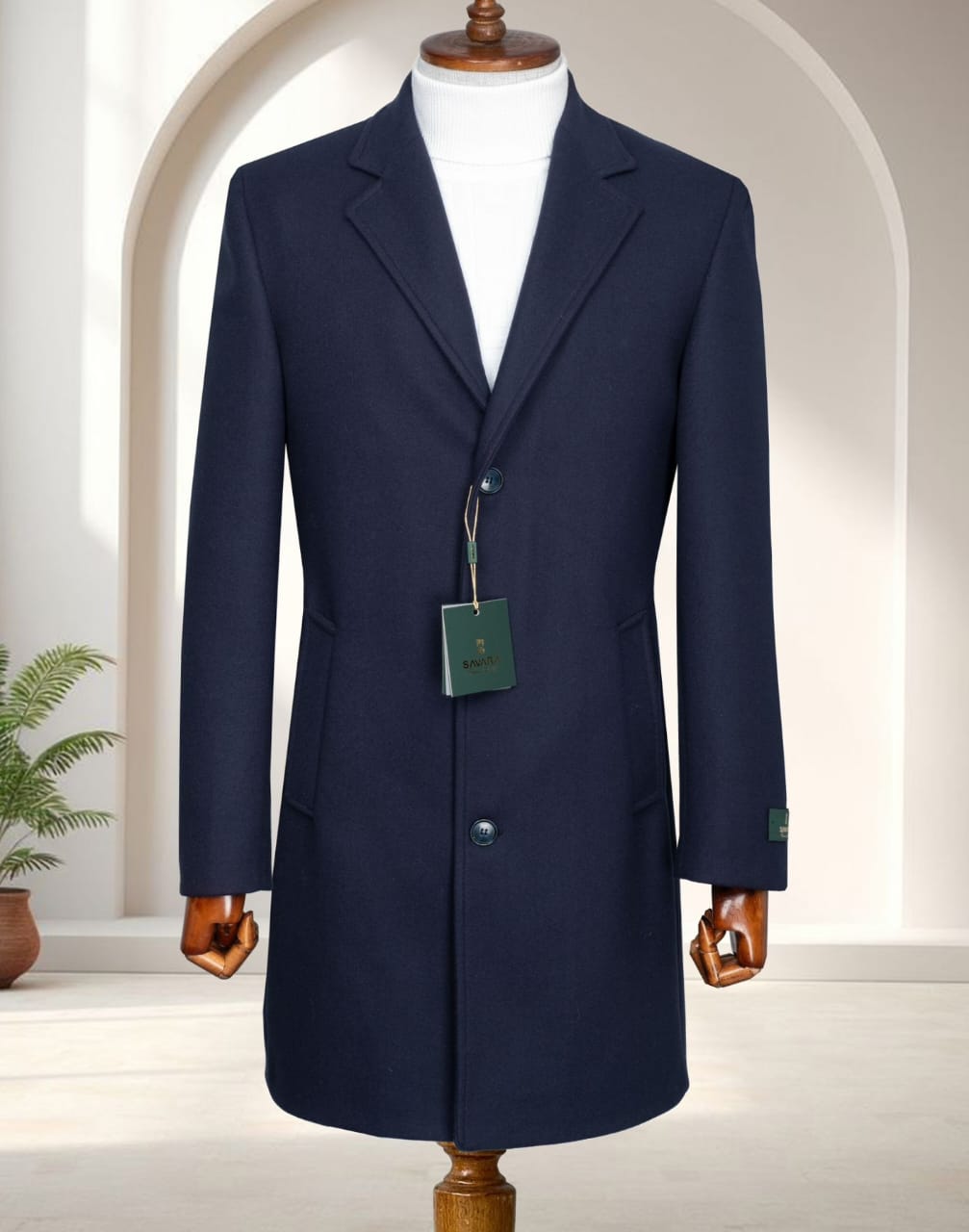 A premium classic navy single-breasted overcoat with notch lapels and a white turtleneck sweater displayed on a mannequin.