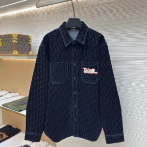 A high-quality Dior Black Oblique Denim Shirt in black denim featuring white contrast stitching and a colorful graffiti-style logo patch on the chest.