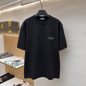 A premium Dior Black T-Shirt hanging on a black hanger, showing the front view with a small signature logo patch and the clean, minimalist back view.