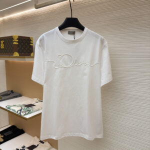 A premium Dior White Braided Logo T-Shirt hanging on a black hanger, showing the front view with braided rope detailing and a clean back view.