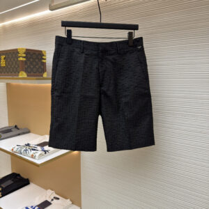 A pair of premium Fendi Men’s Black FF Monogram Jacquard Shorts in black, hanging on a black hanger, displaying the textured woven FF pattern and tailored waistband.