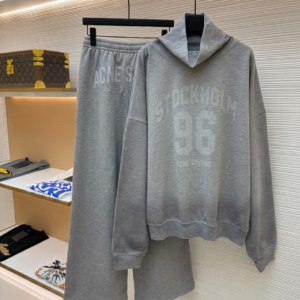 A coordinated Acne Studios Grey Tracksuit Set featuring the Stockholm 96 hoodie and wide-leg sweatpants on display hangers.