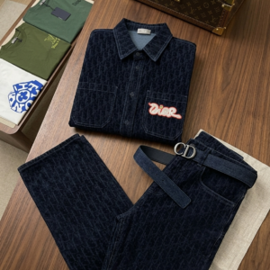 A coordinated Dior Black Oblique Denim Two-Piece Set featuring a black monogram denim shirt and matching straight-leg jeans with colorful logo patches.