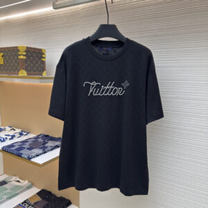 A premium Louis Vuitton Black Crystal Signature T-Shirt in black, hanging on a black hanger, showing the front view with a crystal "Vuitton" signature and a back view with a tonal logo tab.