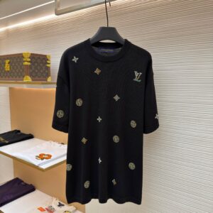 A premium Louis Vuitton Men’s Black Crystal Monogram Knit T-Shirt in black, hanging on a hanger, showcasing shimmering multi-colored crystal monogram motifs across the front and back.
