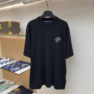 A premium Louis Vuitton Men’s Black Technical Knit Embroidered Signature T-Shirt in black, hanging on a black hanger, showing the front view with white embroidered branding.