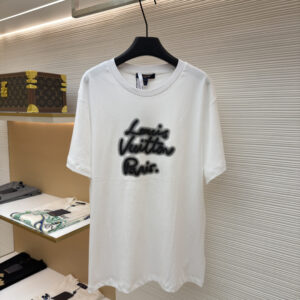 A premium Louis Vuitton Men’s White Paris Spray T-Shirt in white, hanging on a black hanger, displaying the black spray-paint effect logo on the chest.