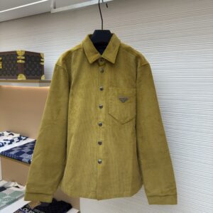 Mustard yellow Prada corduroy overshirt with long sleeves, chest pocket featuring the enamel triangle logo, and metallic snap buttons.
