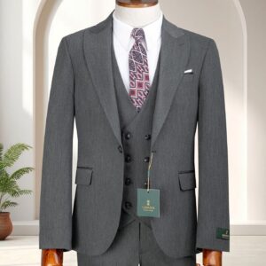A Premium Dove Grey Three-Piece Suit featuring a double-breasted waistcoat and black paisley tie on a wooden mannequin.
