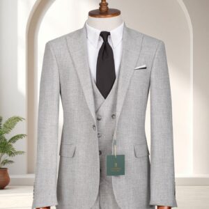 A Premium Heather Grey Three-Piece Suit featuring a double-breasted waistcoat and black textured tie on a wooden mannequin