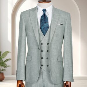 A Premium Mint Green Three-Piece Suit featuring a double-breasted waistcoat and teal paisley tie on a wooden mannequin.