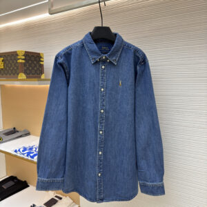 A classic blue denim button-down shirt by Ralph Lauren with a gold embroidered pony logo and adjustable long sleeves.