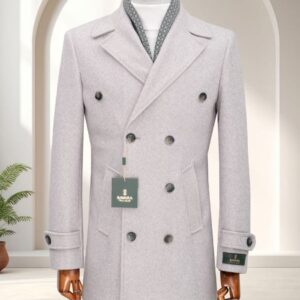 A men's cream double-breasted formal overcoat displayed on a wooden mannequin with a patterned scarf detail.
