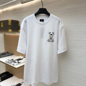 A clean White Embroidered Puppy Cotton T-Shirt with a cute puppy patch on the chest hanging in a luxury boutique.