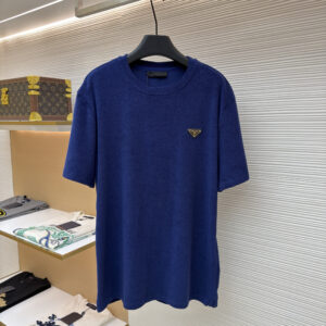 A high-quality Prada Royal Blue Toweling T-Shirt featuring a textured terry cloth fabric and an enameled metal triangle logo.