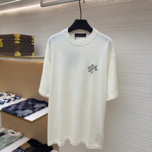 A premium Louis Vuitton Cream Men’s Technical Knit Embroidered Signature T-Shirt in cream, hanging on a black hanger, showing the front view with embroidered branding and a clean back view.