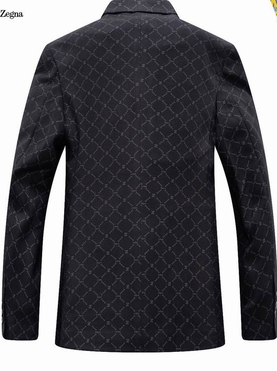 Front and back view of a men's black luxury monogram blazer jacket with a geometric pattern, notch lapels, and two-button closure.