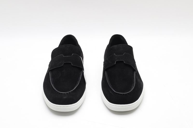 Black suede slip-on loafer sneakers with an H-shaped vamp strap and white rubber soles on a white background.