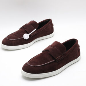 Burgundy suede slip-on loafer sneakers with an H-shaped vamp strap and white rubber soles on a white background.