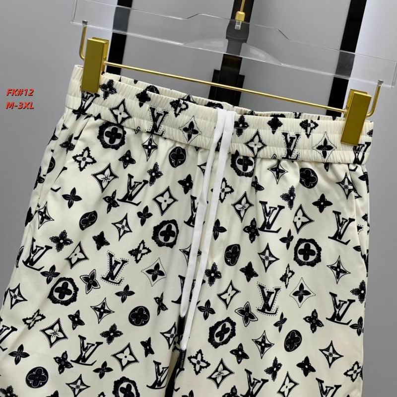 A pair of men's casual off-white shorts hanging from a clear hanger, covered in an all-over black monogram print and featuring a white adjustable drawstring.