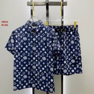A men's matching two-piece casual set featuring a navy blue short-sleeve button-up shirt and shorts, both covered in an all-over white monogram print.