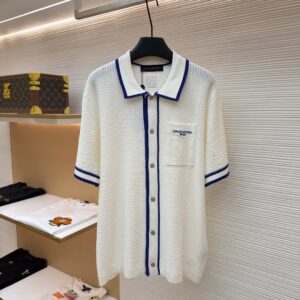 Front and back view of the Louis Vuitton Contrast Trim White Waffle-Knit Polo Shirt hanging on a display, showcasing the blue borders, chest pocket, and rear leather patch.