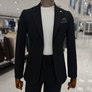Man wearing a lightweight tailored black smart casual suit with a white crew-neck T-shirt, styled for summer weddings, business meetings, evening events, and formal occasions.
