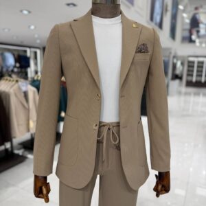 Premium men's beige smart casual suit with a tailored blazer, textured fabric, matching trousers, and a white crew-neck knit, styled for weddings, business meetings, and elegant occasions.