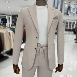 Man wearing a premium tailored beige smart casual suit with a white crew-neck T-shirt, styled for weddings, business meetings, formal occasions, and modern gentleman fashion.