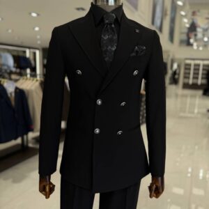 A black double breasted men's suit with peak lapels and a tapered fit, made for weddings, office wear, and formal events.