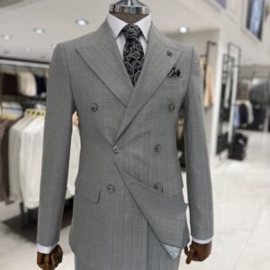 Men’s grey double-breasted suit with subtle check pattern, peak lapels and matching trousers